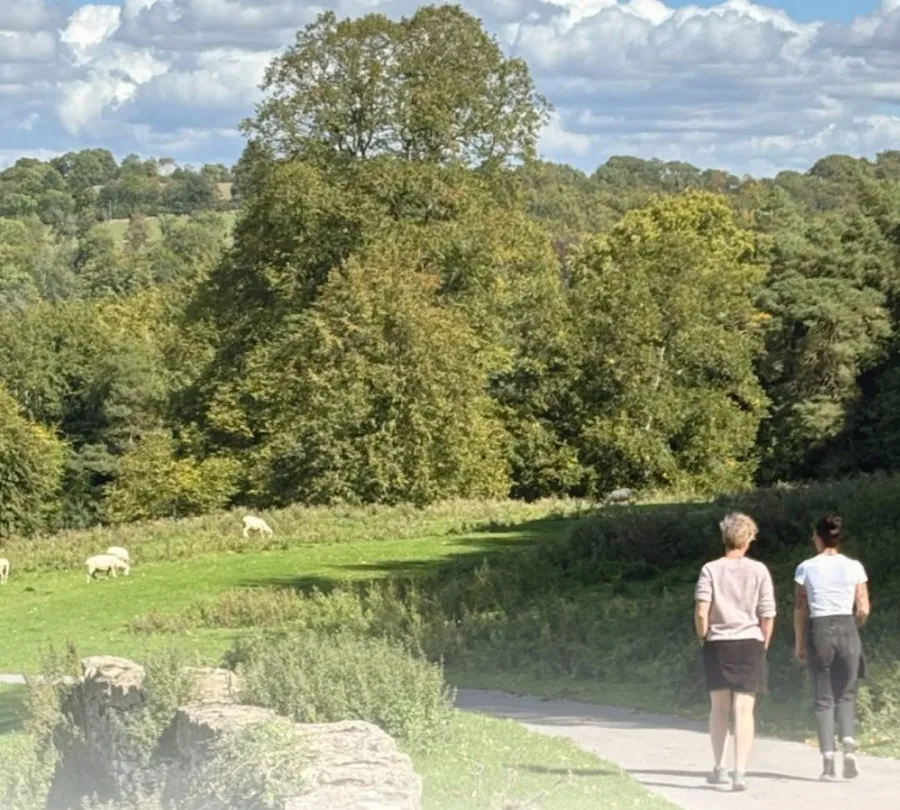 The Miserden team walking in the Cotswold countryside